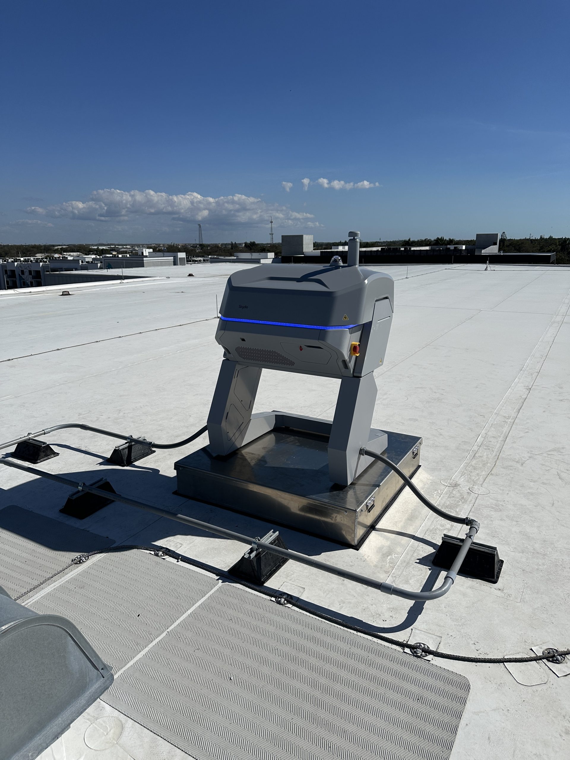 Skydio Dock for X10 installation on a Rapid Systems non-penetrating ballasted Drone Sled on a flat rooftop